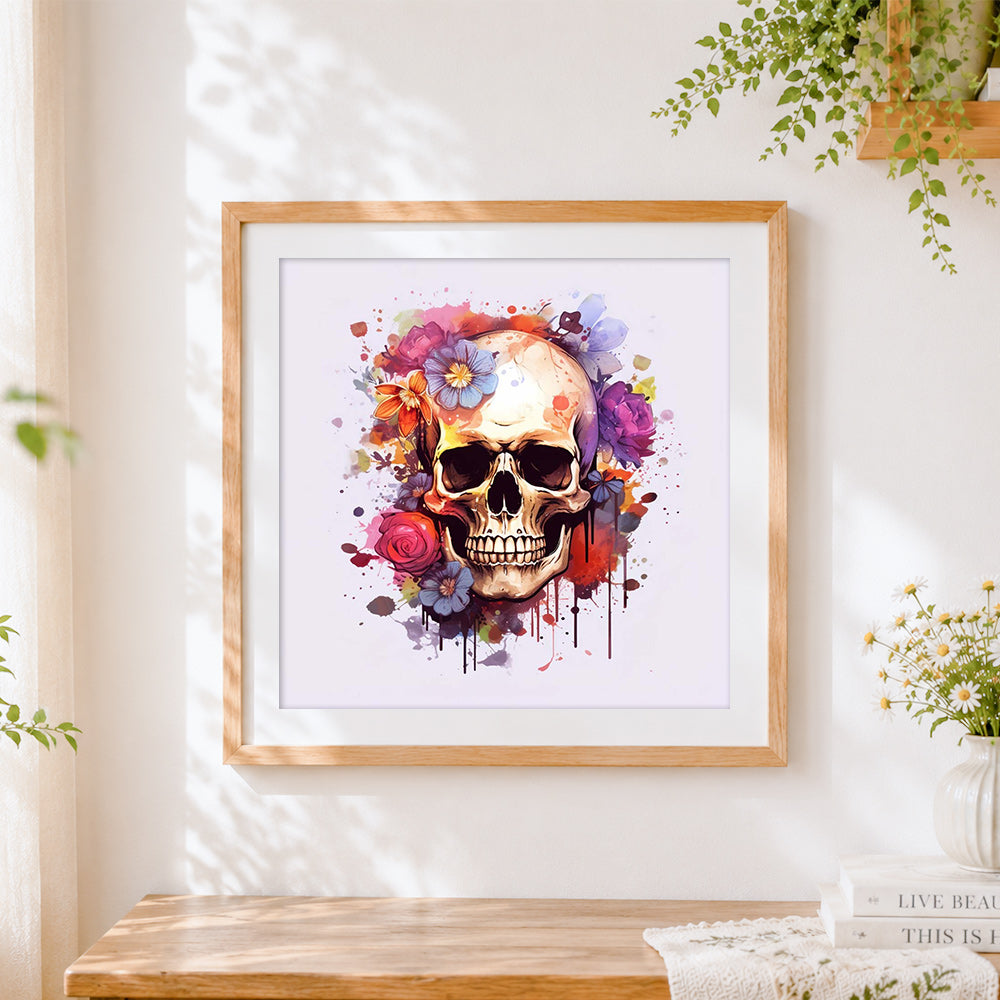 Finished colourful paint splatter floral skull cross stitch artwork displayed