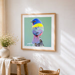 Colourful painted bunting bird cross stitch artwork displayed on wall as home decor