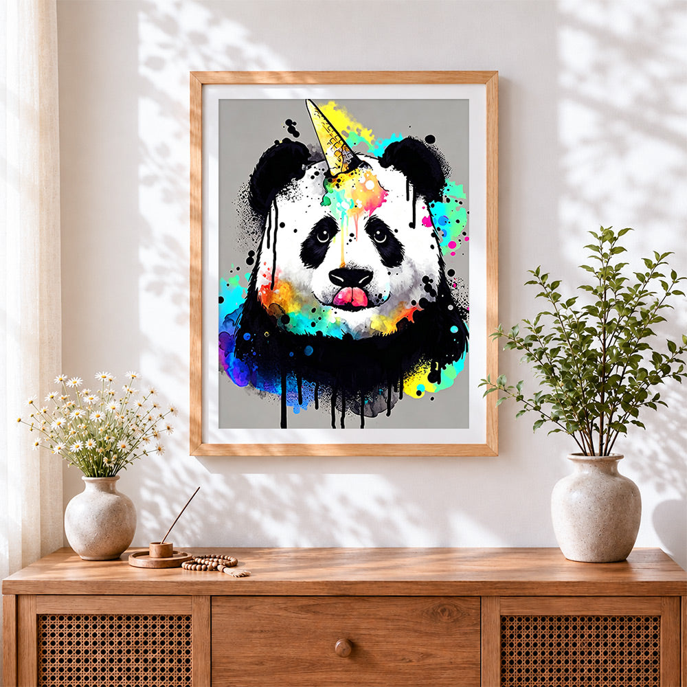 Finished colourful panda with a unicorn horn cross stitch artwork displayed