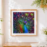 Finished colourful peacock with rainbow feathers cross stitch artwork displayed