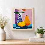 Finished colourful pear and vase still life artwork displayed on a wall