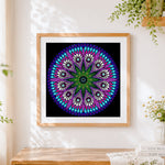 Finished colourful petal mandala cross stitch artwork displayed