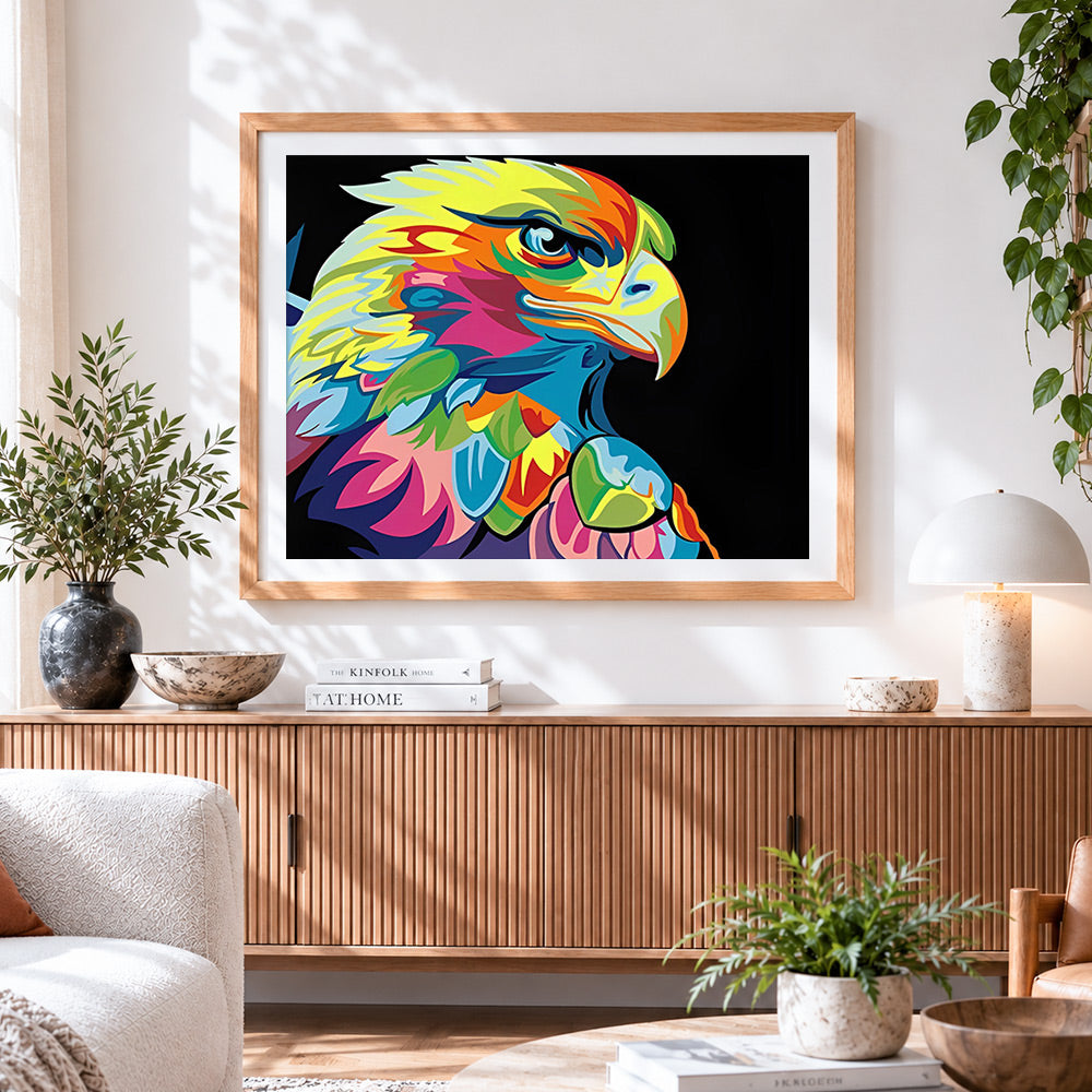 Finished colourful pop art eagle on black background cross stitch artwork displayed