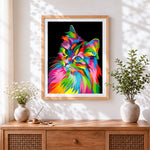 Finished colourful rainbow cat in the dark cross stitch artwork displayed