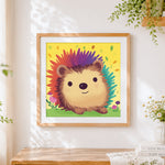 Finished colourful rainbow hedgehog cross stitch artwork displayed