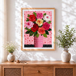 Finished colourful roses in a polka dot vase cross stitch artwork displayed