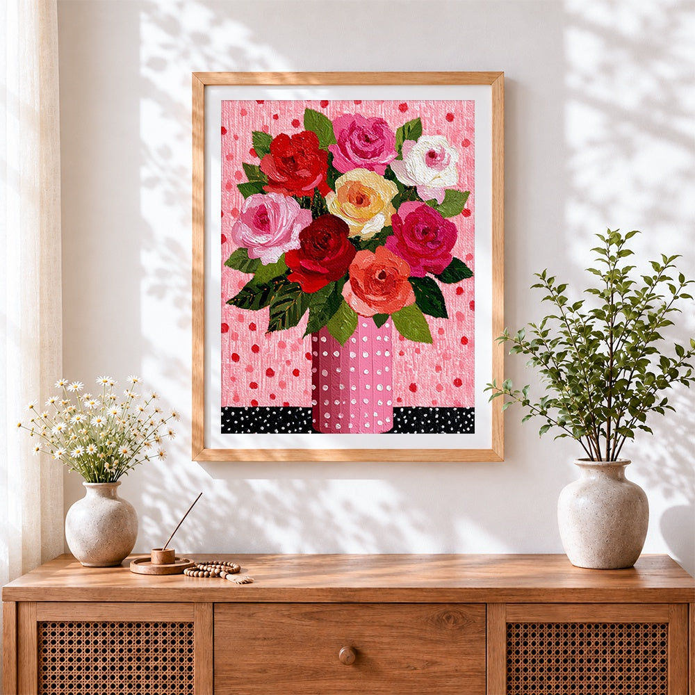 Finished colourful roses in a polka dot vase cross stitch artwork displayed