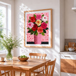 Colourful roses in a polka dot vase cross stitch artwork displayed on wall as home decor