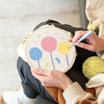 Creating handmade colourful round flowers punch needle artwork