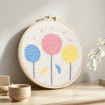 Colourful round flowers punch needle artwork displayed on a table