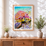 Finished colourful sea turtle underwater cross stitch artwork displayed