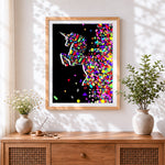 Finished colourful shattered unicorn cross stitch artwork displayed