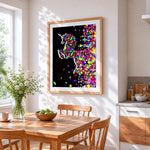 Colourful shattered unicorn cross stitch artwork displayed on wall as home decor