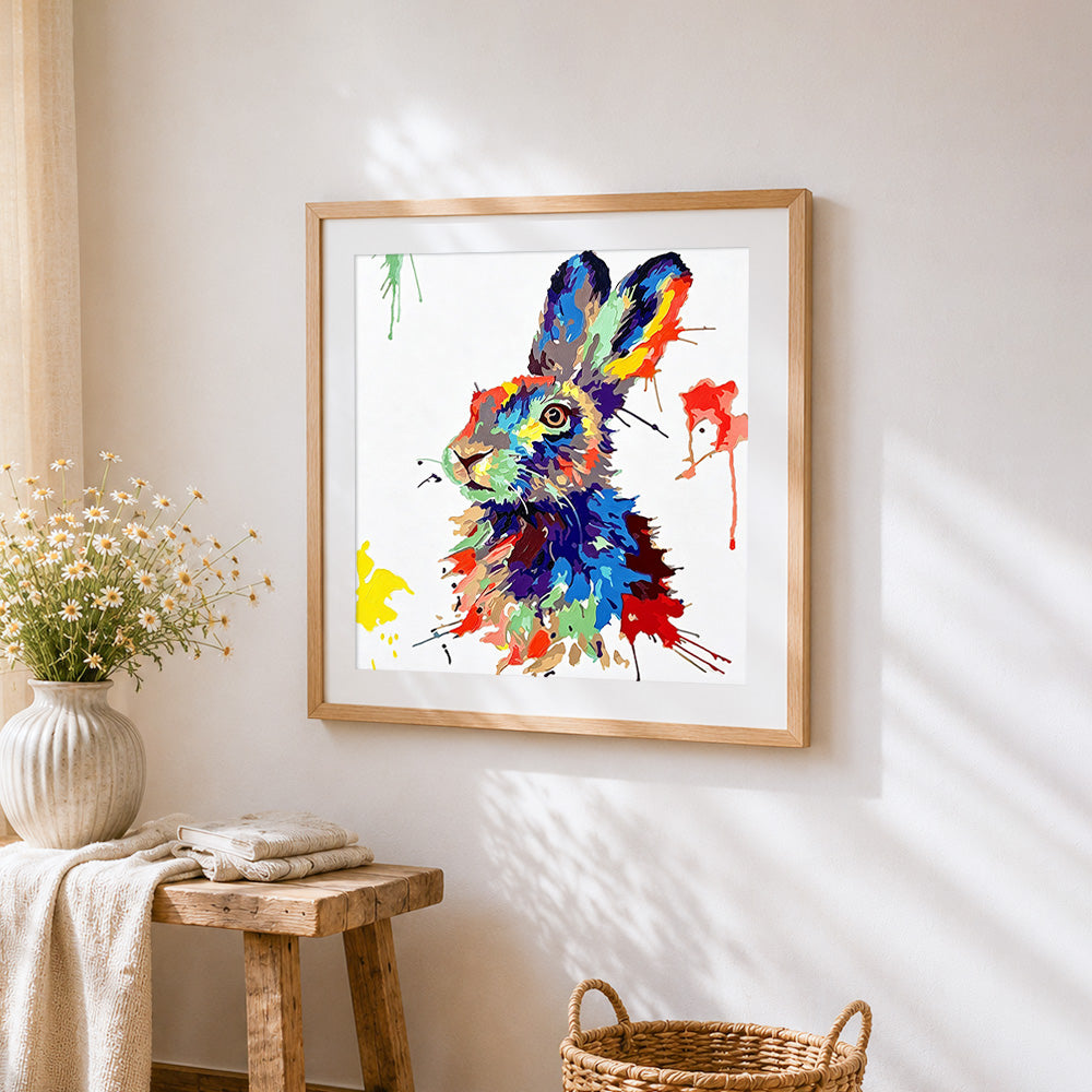 Colourful splatter hare paint by numbers artwork displayed on wall as home decor