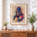 Finished colourful splatter knight's helmet cross stitch artwork displayed