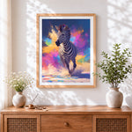 Finished colourful splatter running zebra cross stitch artwork displayed