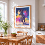 Colourful splatter running zebra cross stitch artwork displayed on wall as home decor