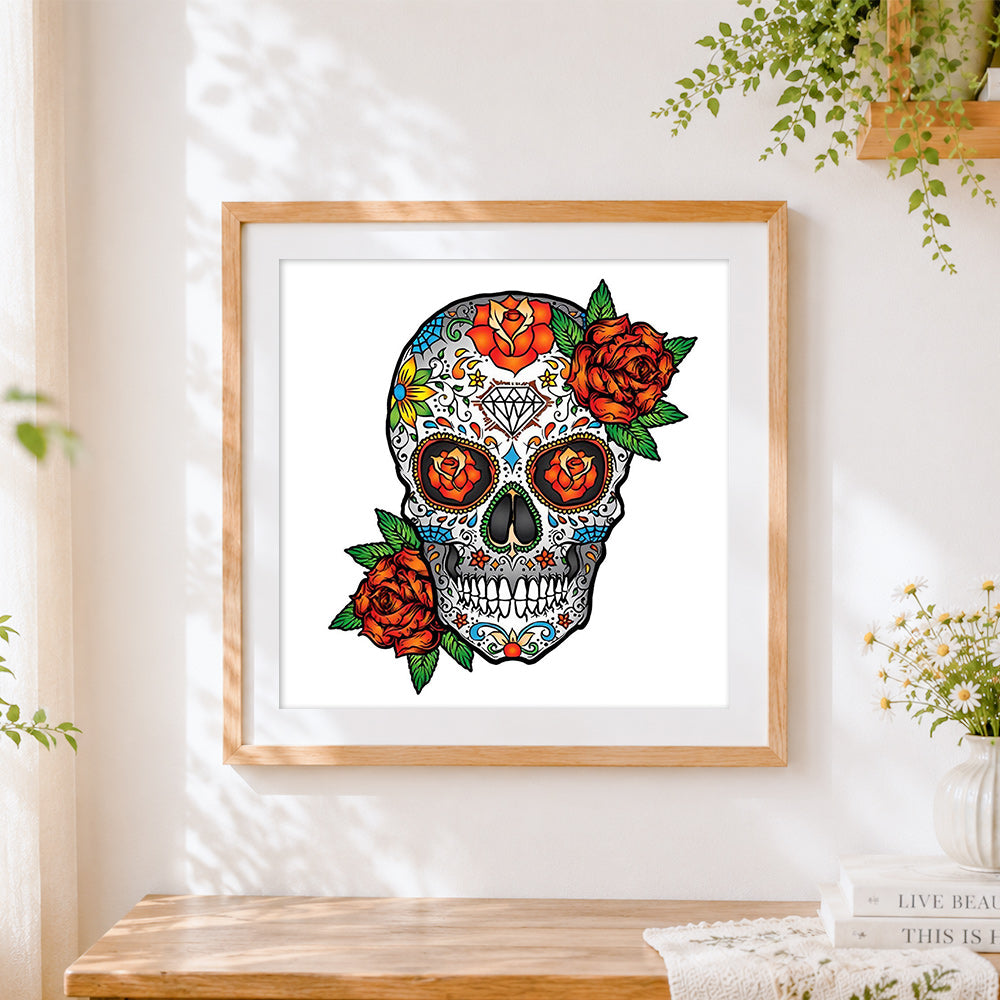 Finished colourful sugar skull with orange roses cross stitch artwork displayed