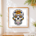 Finished colourful sugar skull with yellow flowers cross stitch artwork displayed