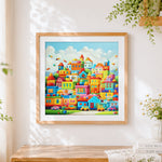 Finished colourful toy block city cross stitch artwork displayed