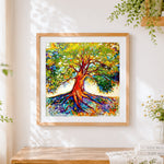 Finished colourful tree with deep roots cross stitch artwork displayed