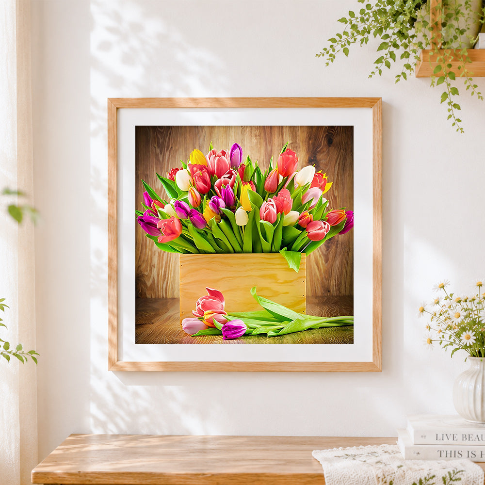 Finished colourful tulips in a wooden crate cross stitch artwork displayed