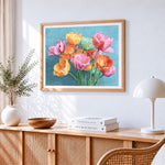 Colourful tulips on a teal background cross stitch artwork displayed on wall as home decor
