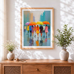 Finished colourful umbrellas in the rain cross stitch artwork displayed