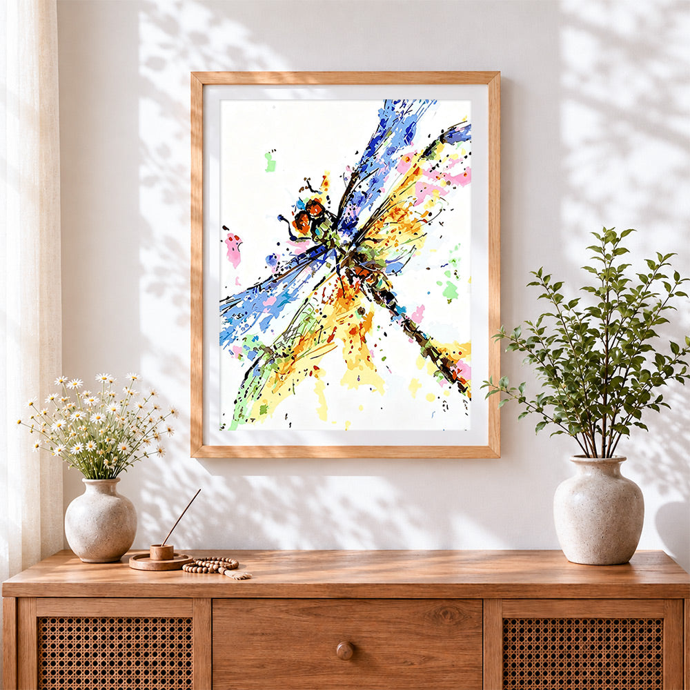 Finished colourful watercolour dragonfly cross stitch artwork displayed