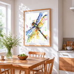Colourful watercolour dragonfly cross stitch artwork displayed on wall as home decor
