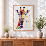 Finished colourful watercolour giraffe splatter cross stitch artwork displayed