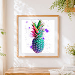 Finished colourful watercolour pineapple cross stitch artwork displayed