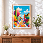 Finished colourful whimsical town street cross stitch artwork displayed