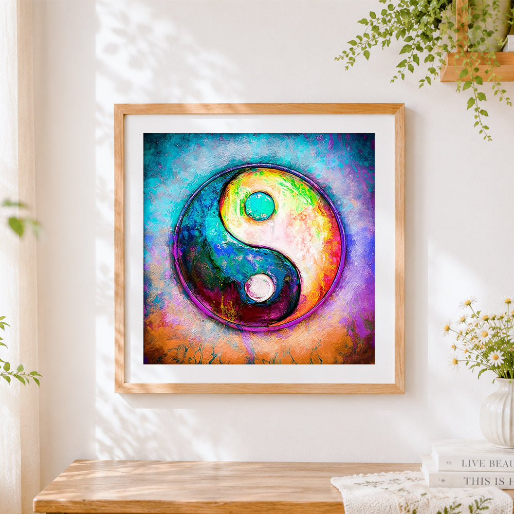 Finished colourful yin yang symbol cross stitch artwork displayed