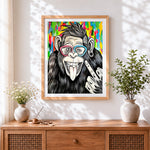 Finished cool chimpanzee with colourful glasses cross stitch artwork displayed