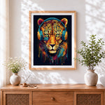 Finished cool leopard with blue headphones cross stitch artwork displayed