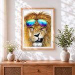 Finished cool lion with aviator sunglasses cross stitch artwork displayed