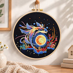 Cosmic betta fish embroidery hoop wall art displayed as warm and cosy handmade home decor
