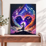 Finished cosmic heart silhouette pearl diamond painting artwork displayed as home decor