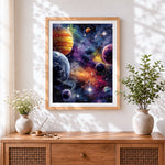 Finished cosmic planets and galaxies cross stitch artwork displayed
