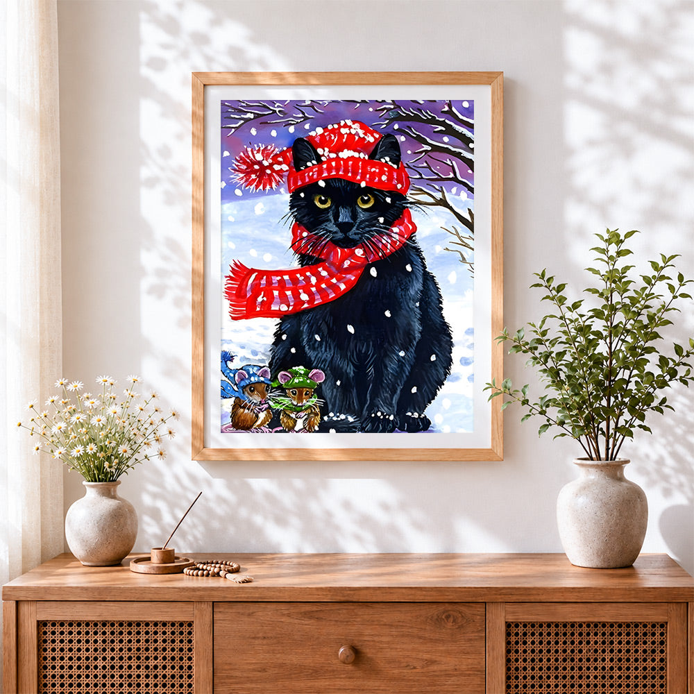 Finished cosy black cat in red scarf cross stitch artwork displayed