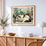 Cosy calico cat sleeping on books cross stitch artwork displayed on wall as home decor