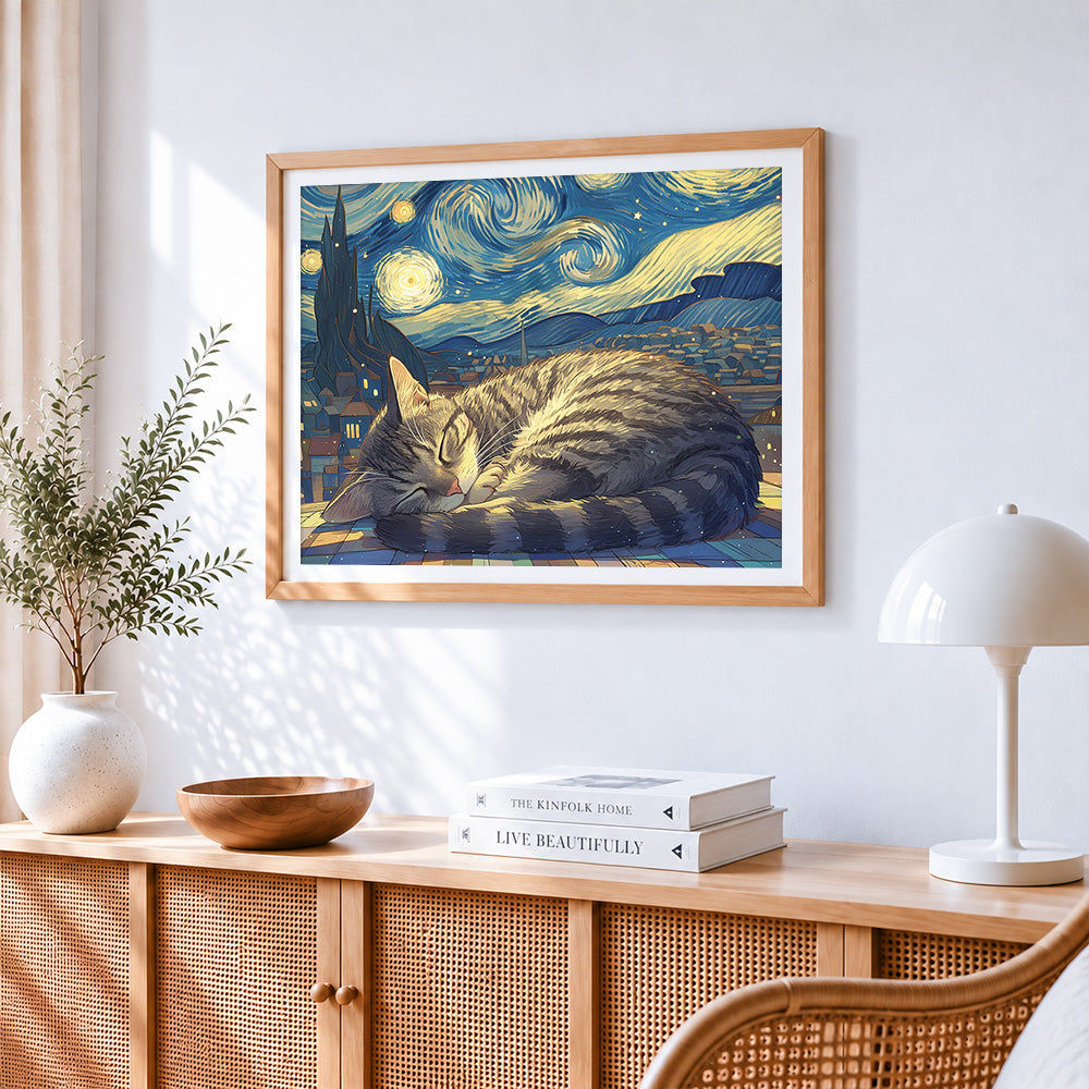 Cosy cat sleeping under a starry night cross stitch artwork displayed on wall as home decor