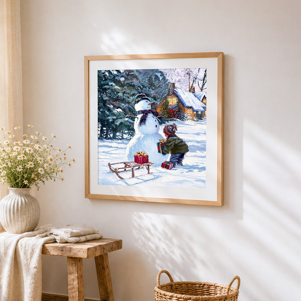 Cosy christmas snowman, child and gifts cross stitch artwork displayed on wall as home decor