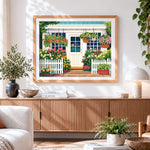 Finished cosy cottage with hanging baskets paint by numbers artwork displayed as home decor