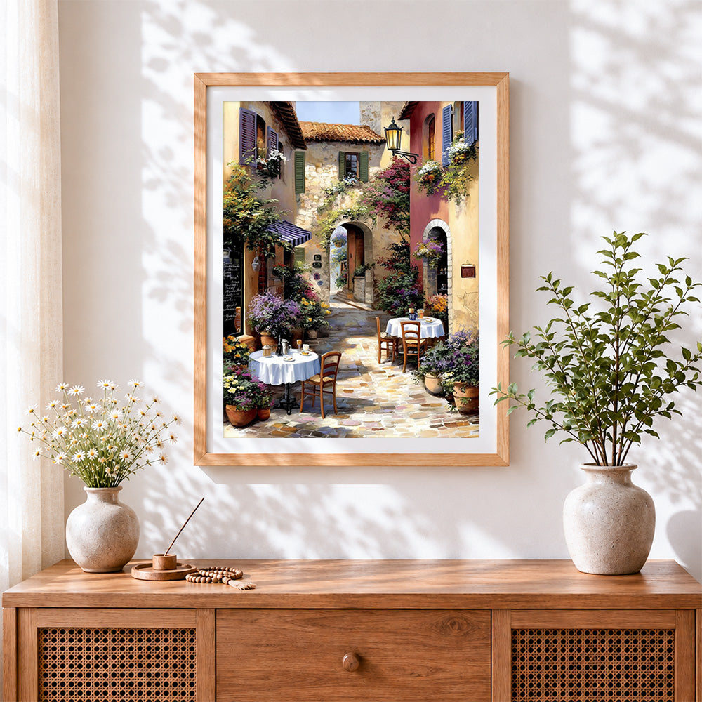 Finished cosy italian cafe courtyard cross stitch artwork displayed