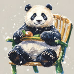 Cosy panda sitting on a chair in the snow cross stitch kit for beginners