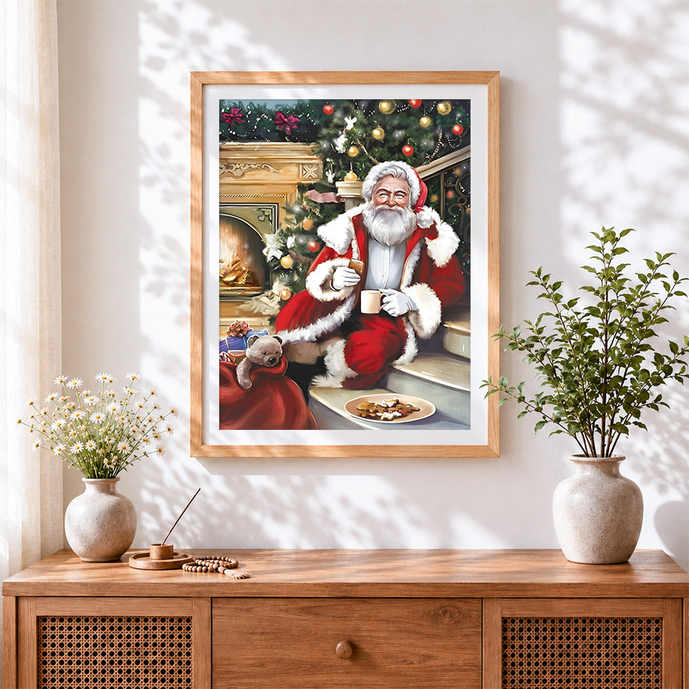 Finished cosy santa relaxing with a hot drink cross stitch artwork displayed