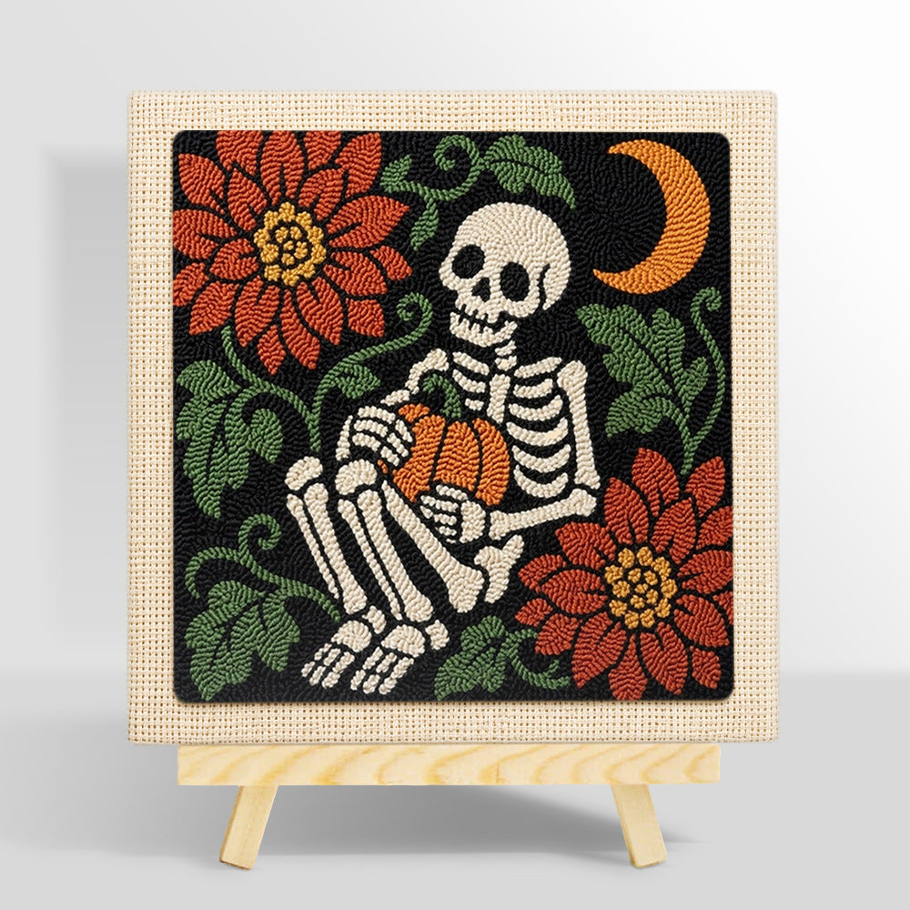 Cosy skeleton holding pumpkin punch needle kit for beginners