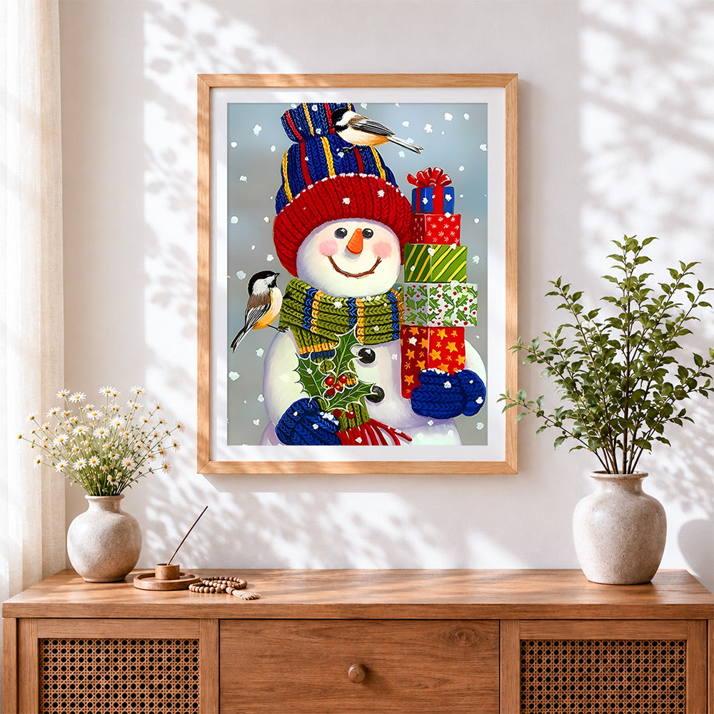 Finished cosy snowman with knitted hat cross stitch artwork displayed